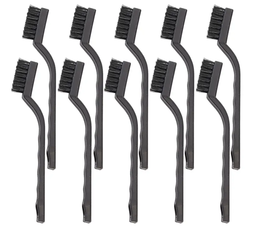 Anti-static cleaning brushes used for removing dust from laptop fans and vents.